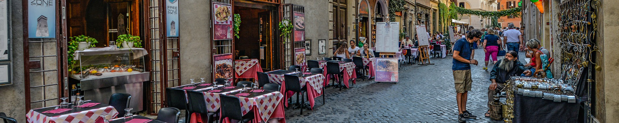 View of street in Italy, cafe and street vendor