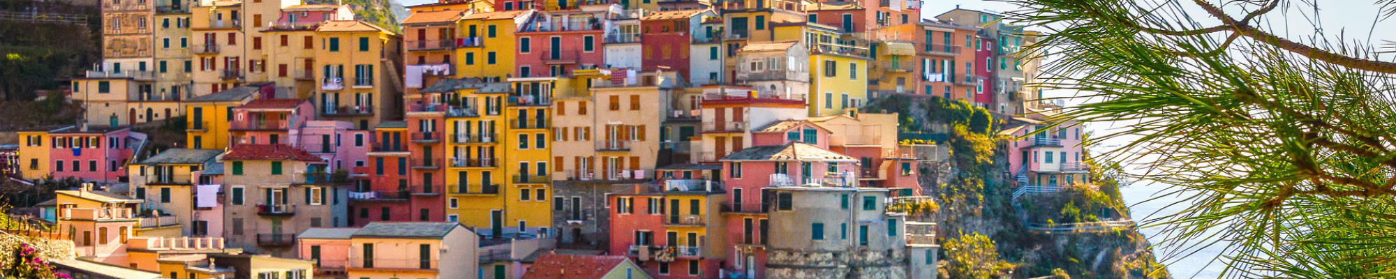 Brightly colored homes on hill on Italian coast