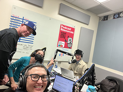 group of people in sound recording booth